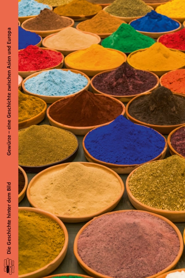 Buchcover "Gewürze - eine Geschichte zwischen Asien und Europa" von Jürgen G. Nagel. Das Cover zeigt haufenweise indische Gewürze in unterschiedlichen Farben. 